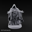 Ammo Draped Cross Bearing Human Monk — None