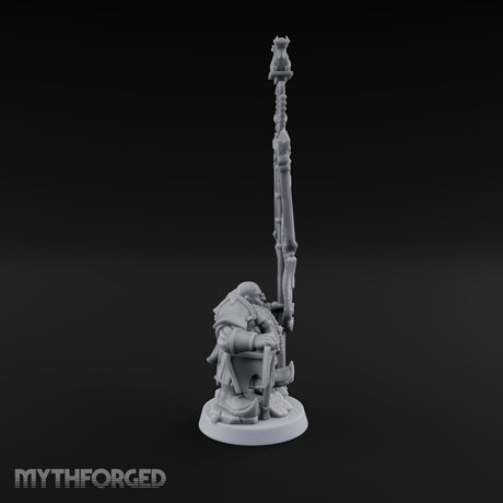 Holding the Standard Dwarf Standard Bearer Miniature for Dungeons and Dragons, Pathfinder or other TTRPGs
